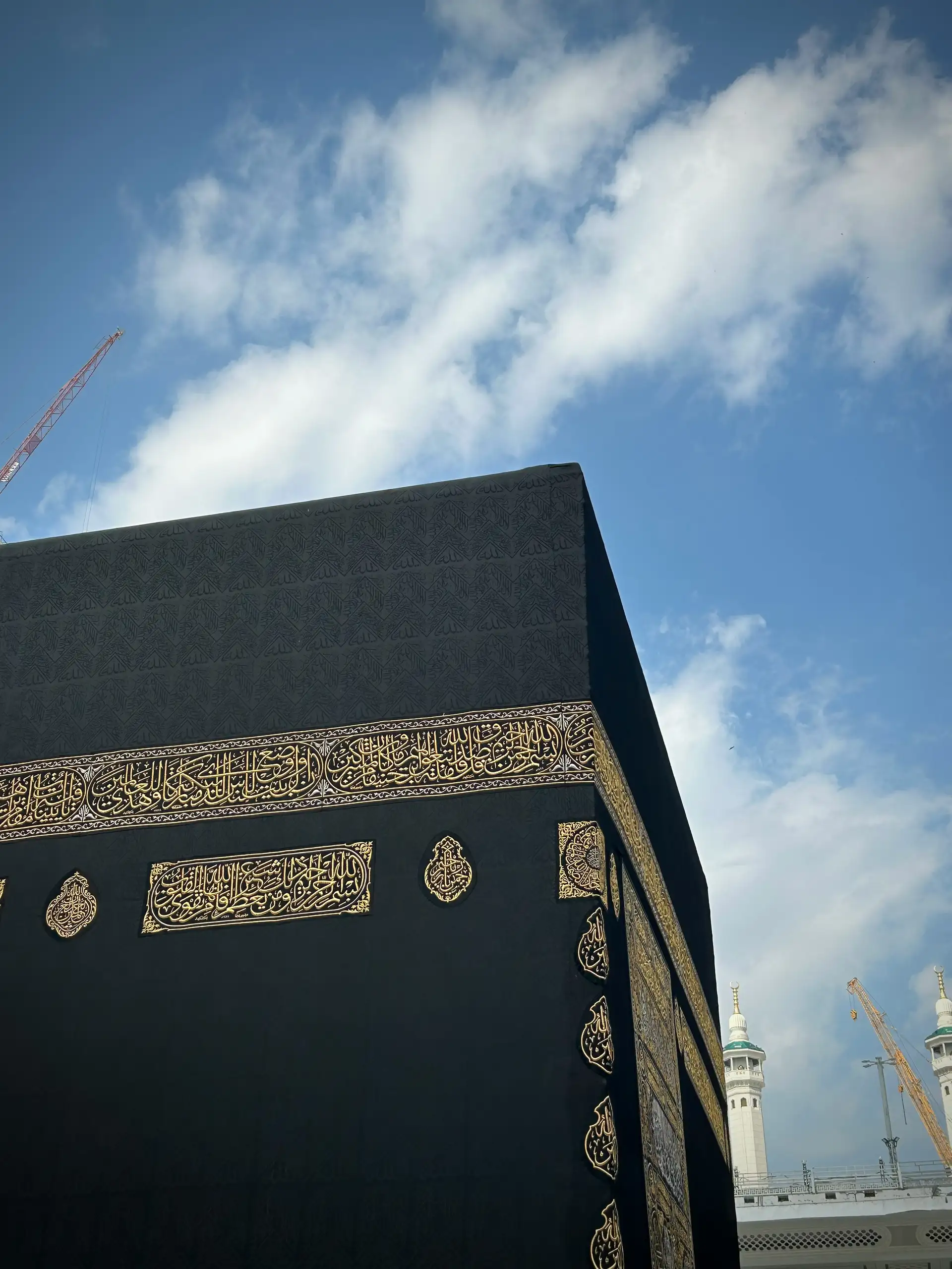 The Kaaba draped in the black kiswah with gold calligraphy