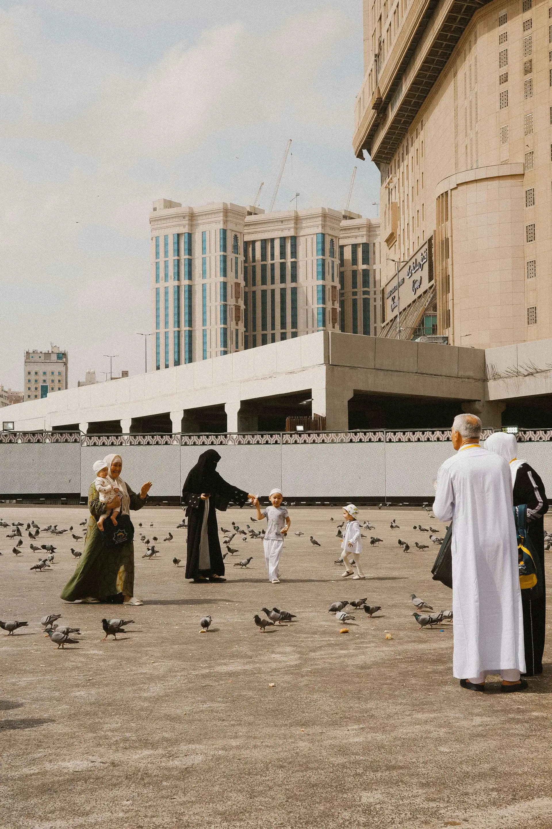 Pilgrims and families in the courtyard of Masjid an-Nabawi, Madinah